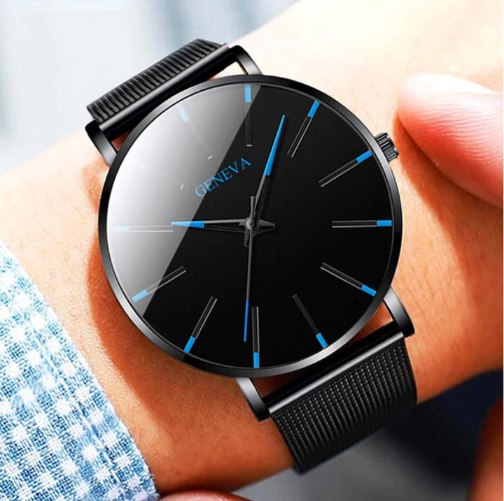 Close-up of a men's minimalist quartz watch, highlighting the blue accents and classic black strap.