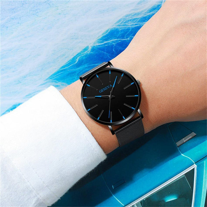 Stylish men's elegant timepiece. This minimalist watch features blue accents & a comfortable black strap.