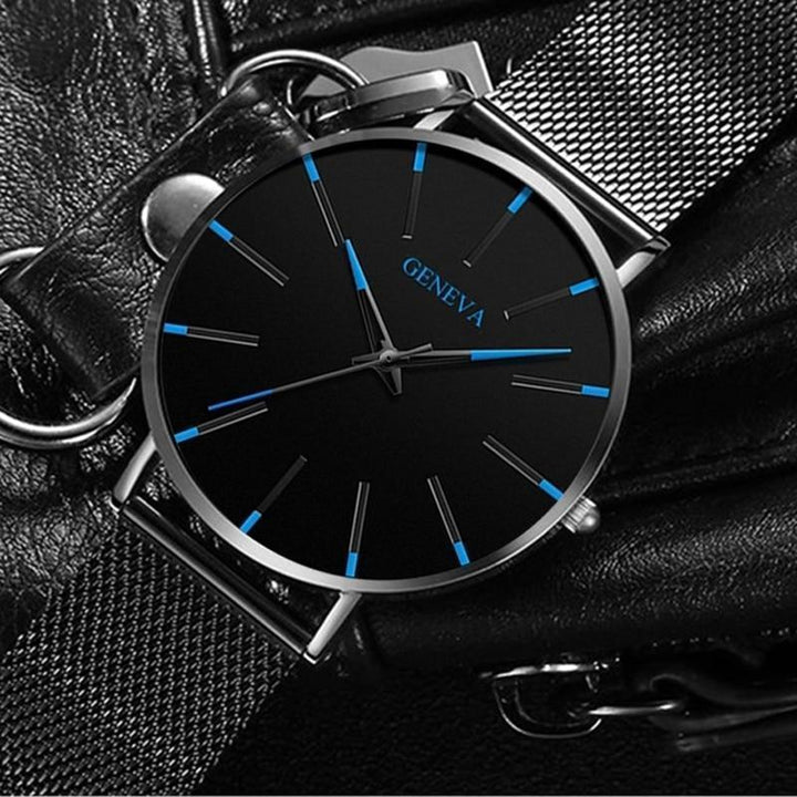 Sleek men's watch showcasing minimalist aesthetics, blue dial accents, and a comfortable black strap for any outfit.
