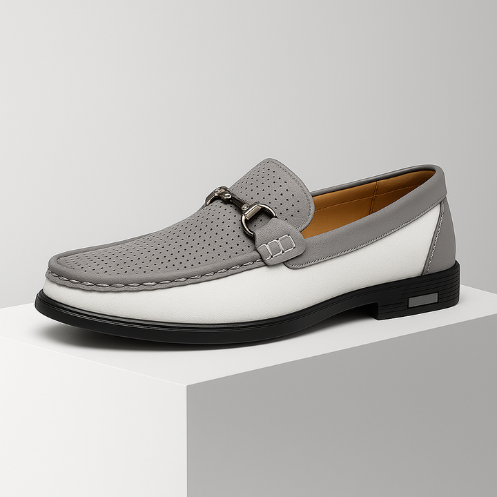 Close-up of the stylish bit detail on men's modern slip-on loafers, showcasing quality.