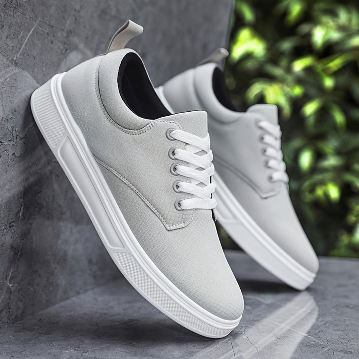 Close-up of men's modern comfort dress shoes, showcasing quality material & stylish craftsmanship.