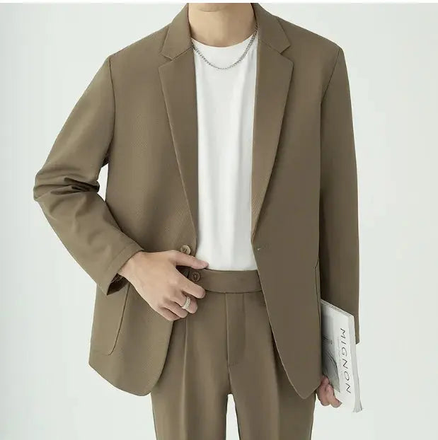 Men's modern minimalist two-piece suit in a tailored fit for formal elegance.