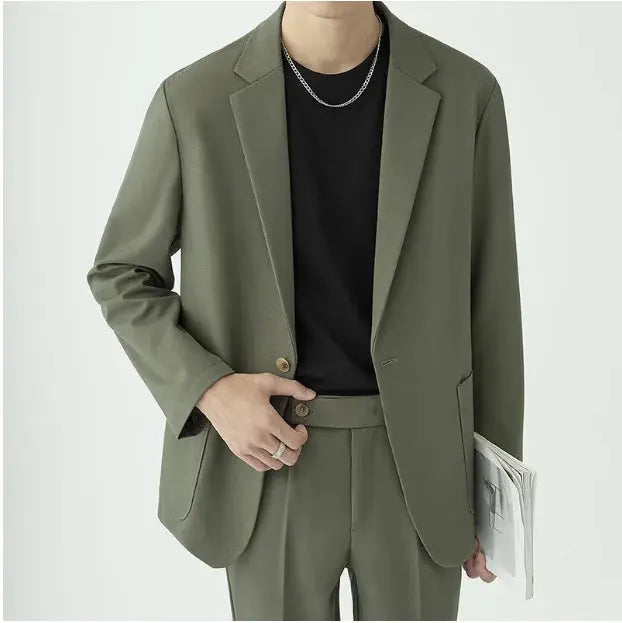 Modern minimalist men's suit with a tailored fit, showcasing contemporary formal menswear.