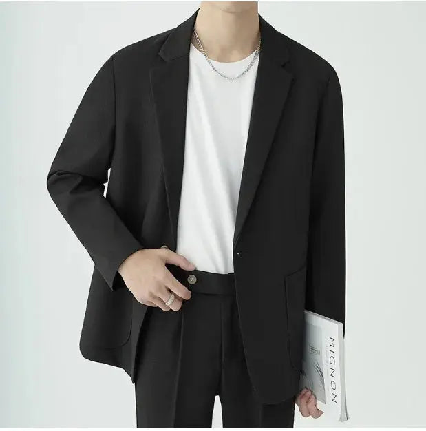 Stylish dark charcoal men's two-piece suit, a minimalist design for sophisticated formal & business wear.