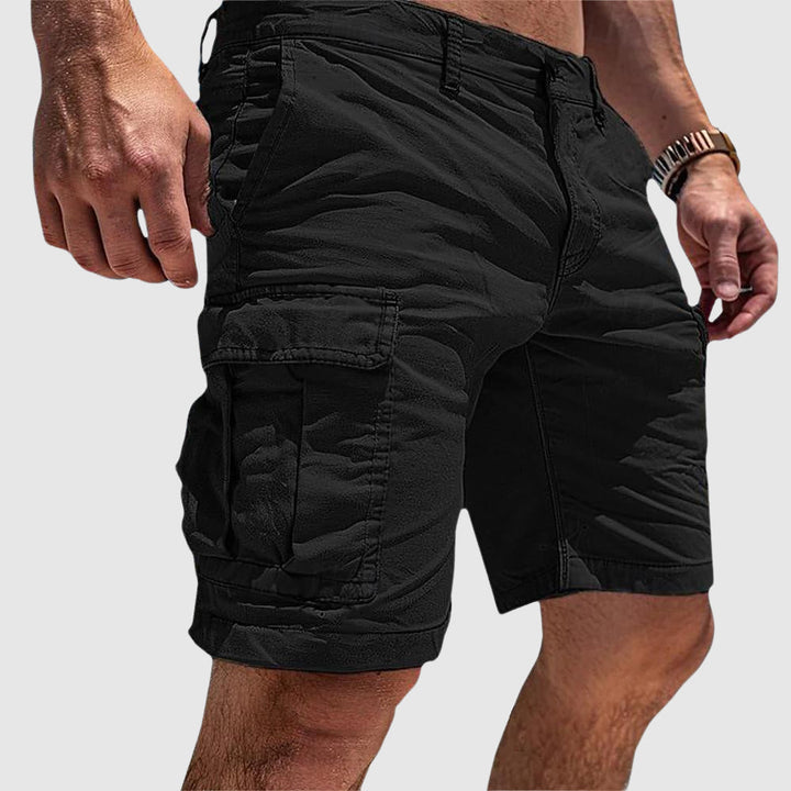 Knee-length men's cargo shorts, ideal for spring & summer fashion, offering a relaxed fit and practical storage.