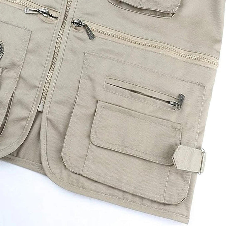 Men's outdoor utility vest with numerous pockets, great for hiking, travel & adventure gear.