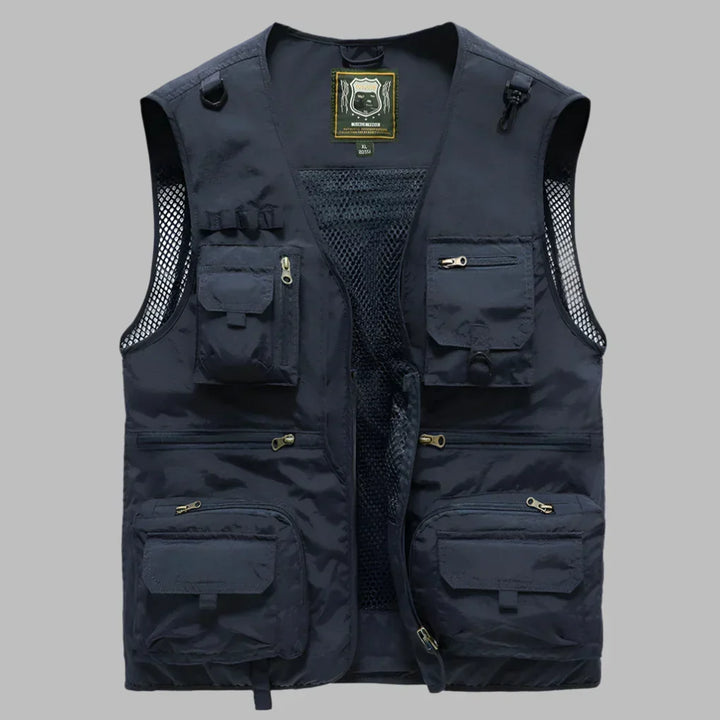 Rugged men's outdoor utility vest with many pockets, designed for durability in hiking, camping, and everyday use.