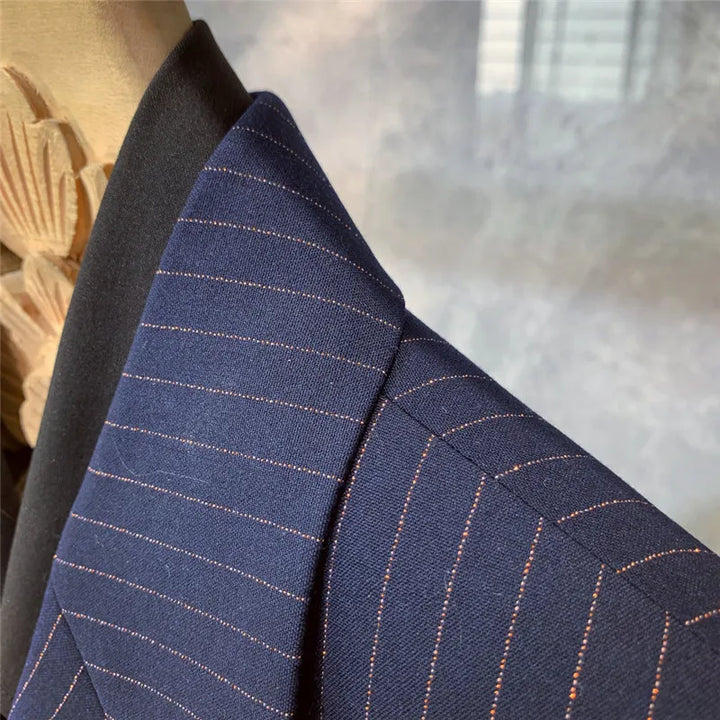 Classic men's navy pinstripe suit. Versatile formal wear for business, special occasions, and evening events.