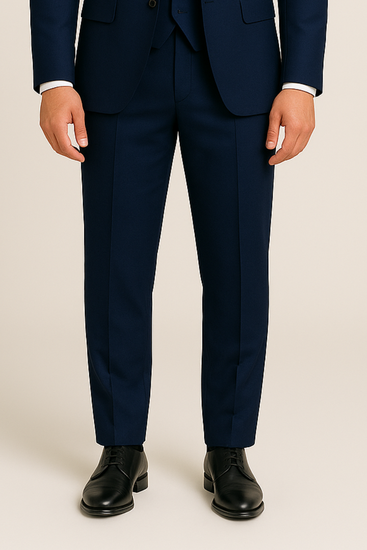 Tailored slim fit men's navy three-piece suit. Sophisticated formal attire for weddings, business & elegant events.