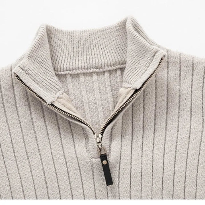 Sophisticated men's ribbed half-zip sweater in neutral tones. Modern fit layering piece for comfort.