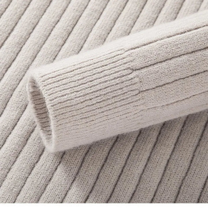 Versatile men's half-zip ribbed knitwear in a neutral tone. Perfect for layering and sophisticated fashion.