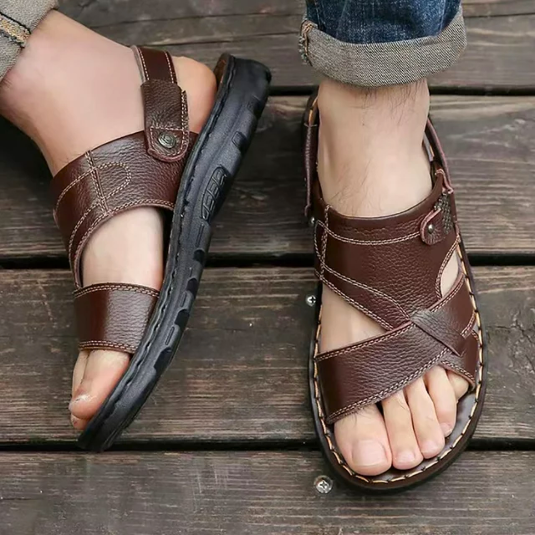 Men's foot wearing comfortable orthopedic sandals, showing casual summer style and arch support.