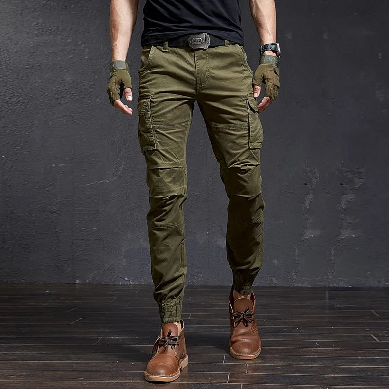 Men's Outland tactical cargo pants, tapered fit, cuffed ankle. Rugged utility wear for action & outdoor style.