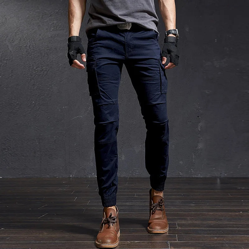 Stylish Outland men's cargo pants, utility pockets, tapered leg, cuffed ankle. Perfect for streetwear & action.