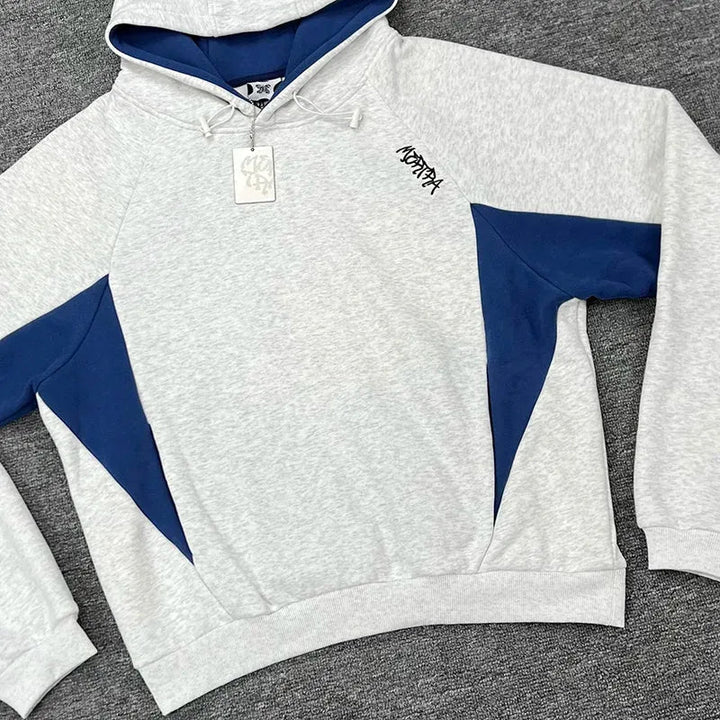 Men's oversized pullover hoodie with sporty contrast panels. Ideal for casual wear, streetwear fashion.