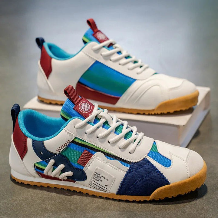 Front view of men's patchwork utility sneakers, featuring athletic design and comfortable fit for daily wear.