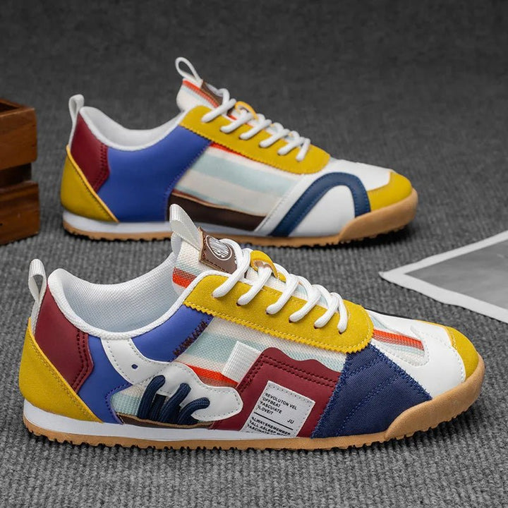 Side profile of men's patchwork utility sneakers, highlighting trail-ready features & streetwear aesthetic.