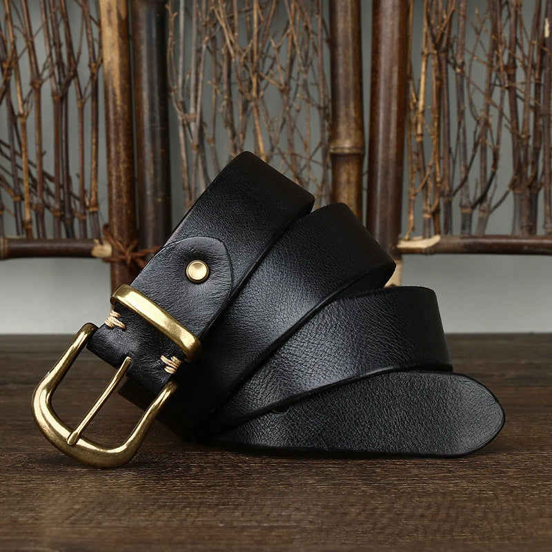 Close-up of the classic silver buckle on a premium full-grain leather men's belt.