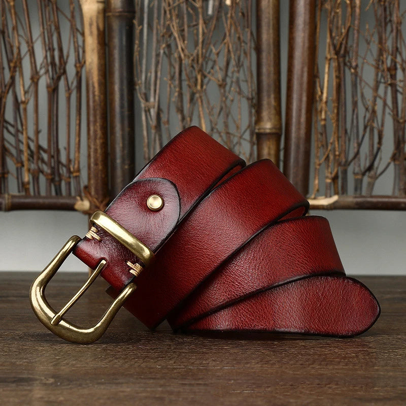 Stylish men's handcrafted full-grain leather belt paired with formal trousers.