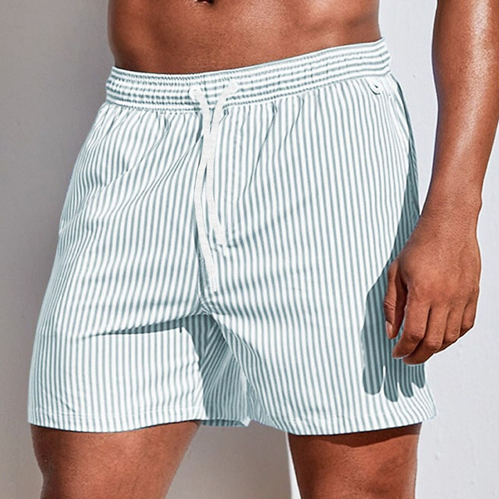 Stylish striped men's beachwear shorts, fast-drying for comfortable pool and ocean fun.