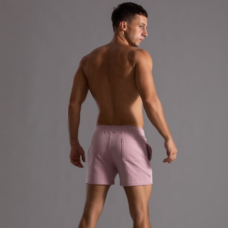 Close-up of quick-drying ripstop fabric texture on men's stylish swim trunks.