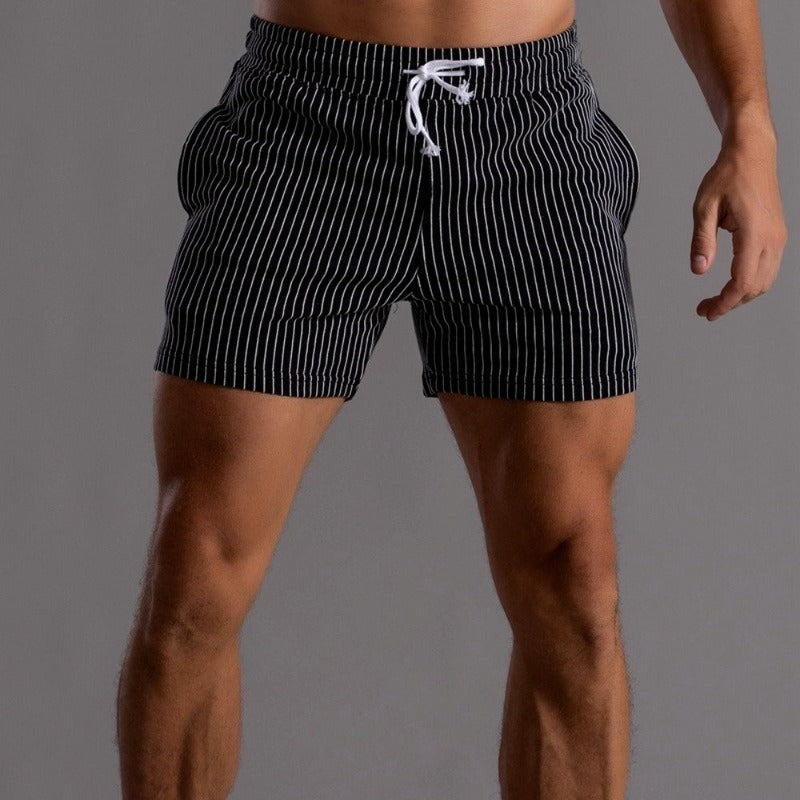 Elastic waistband on men's quick-dry swim shorts, comfortable for summer.