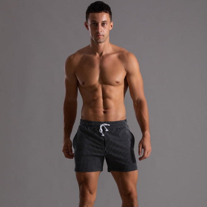Men's quick-drying beach shorts, stylish ripstop swimwear for sunny days.