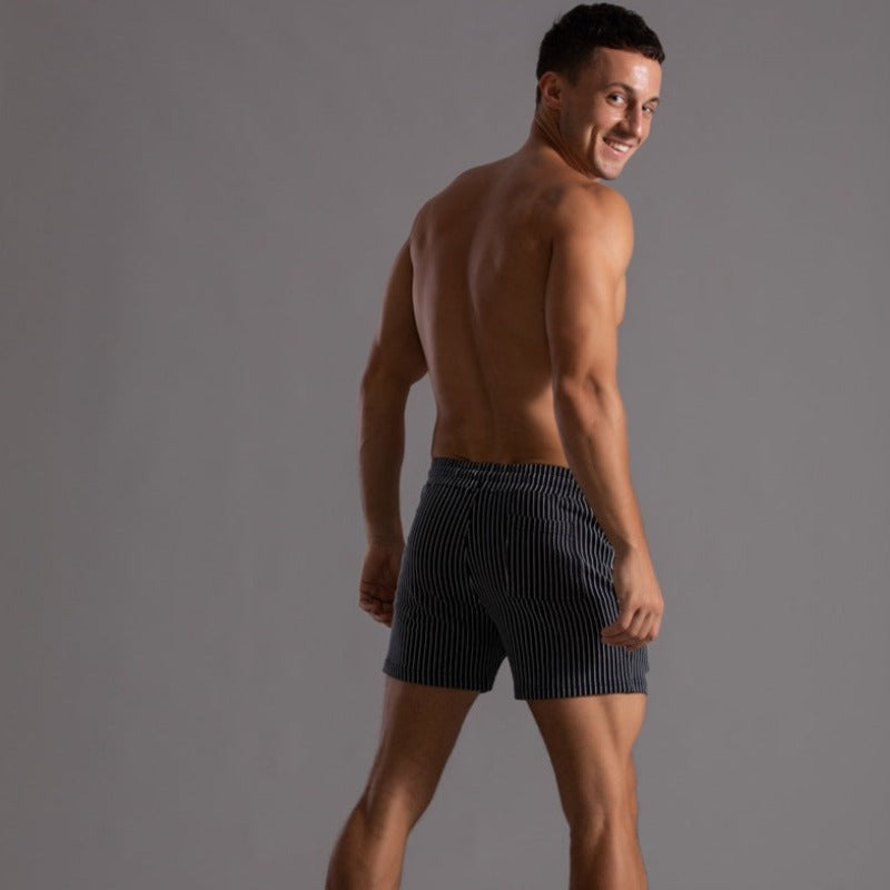 Men's athletic quick-dry swim trunks, perfect for the pool and water activities.