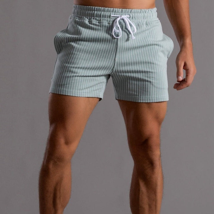 Trendy men's quick-drying swim shorts, ripstop polyester for modern beachwear.