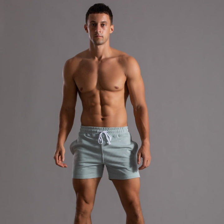 Lightweight quick-dry men's swim trunks, essential ripstop swimwear for travel.