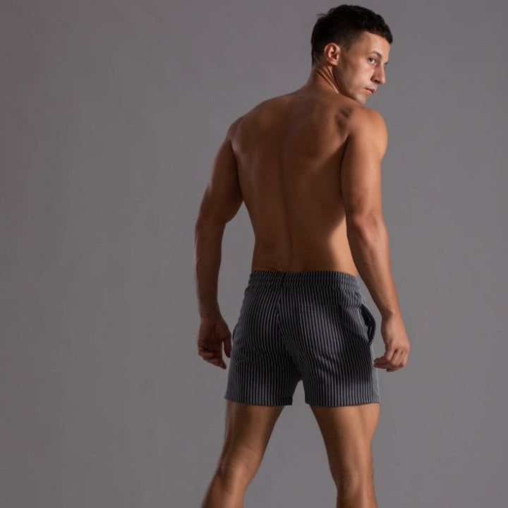 Breathable quick-drying men's swim shorts, ripstop fabric for active wear.