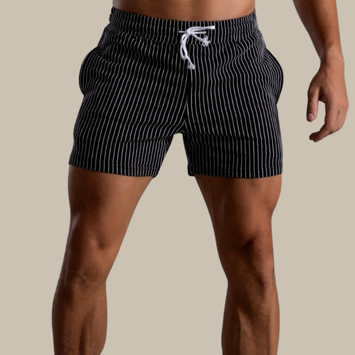Athletic men's quick-dry swim shorts perfect for pool and beach leisure.