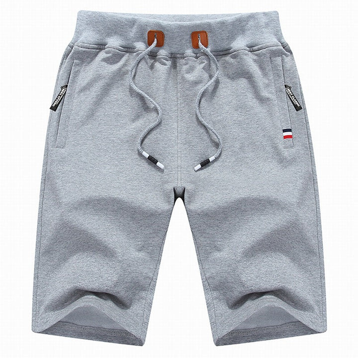 Versatile men's relaxed fit drawstring shorts, comfortable for summer, gym, or casual outings.