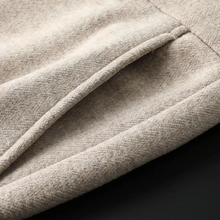 Close-up of men's Regent tailored trousers fabric, showing quality & luxurious feel.
