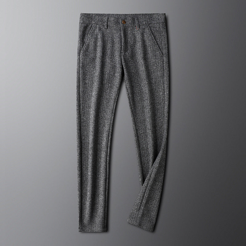 Man wearing elegant Regent tailored trousers, showcasing a smart, sophisticated formal style.