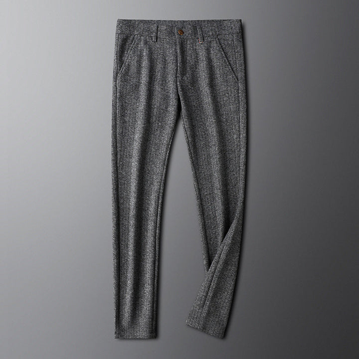 Man wearing elegant Regent tailored trousers, showcasing a smart, sophisticated formal style.