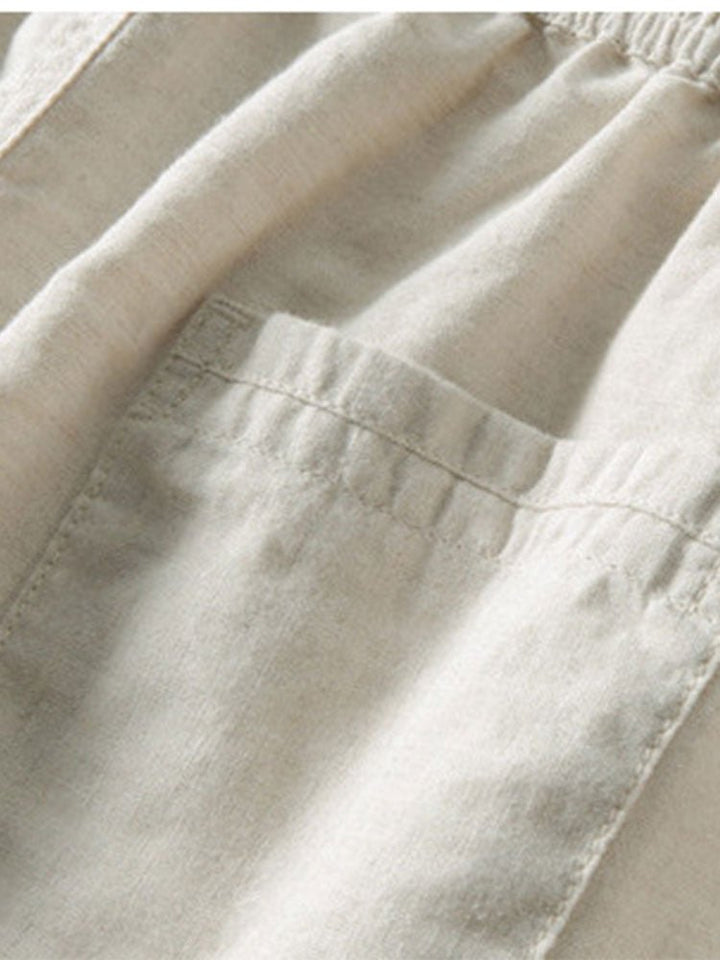 Men's casual relaxed outfit set, a comfortable band collar shirt with coordinating trousers.