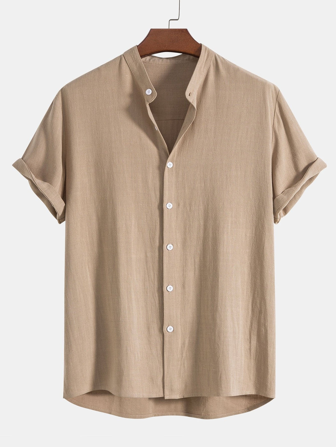 Stylish man wearing a men's relaxed band collar shirt and matching trousers co-ord set.