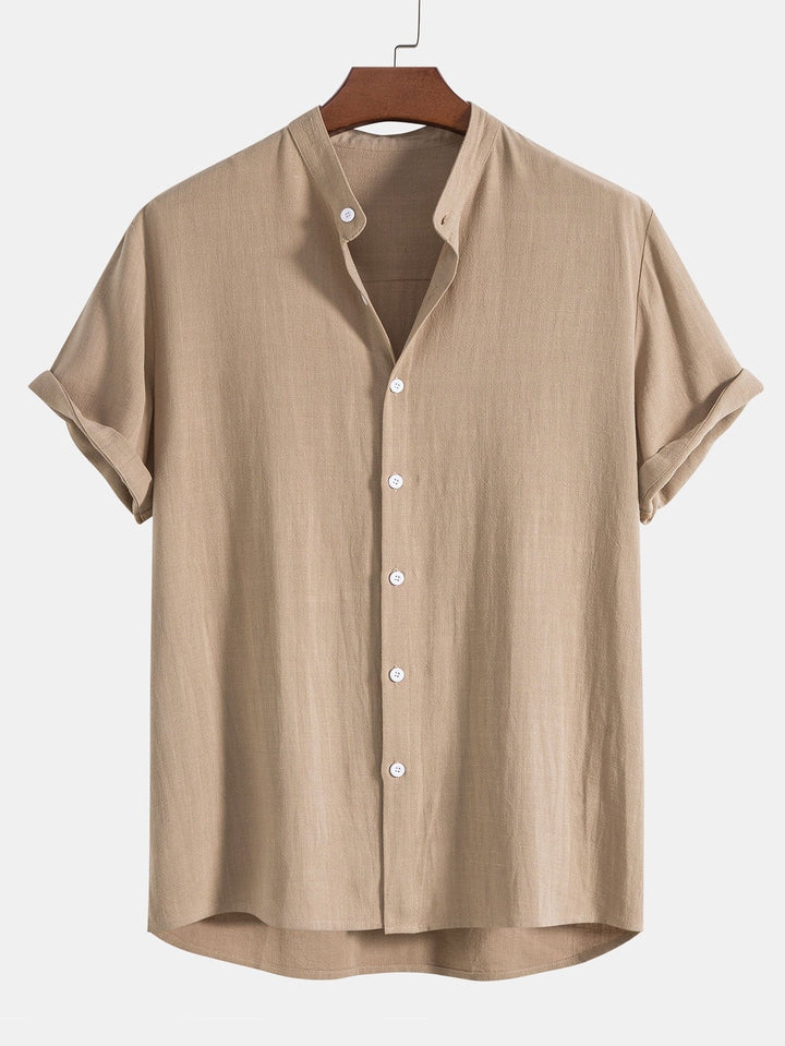 Stylish man wearing a men's relaxed band collar shirt and matching trousers co-ord set.