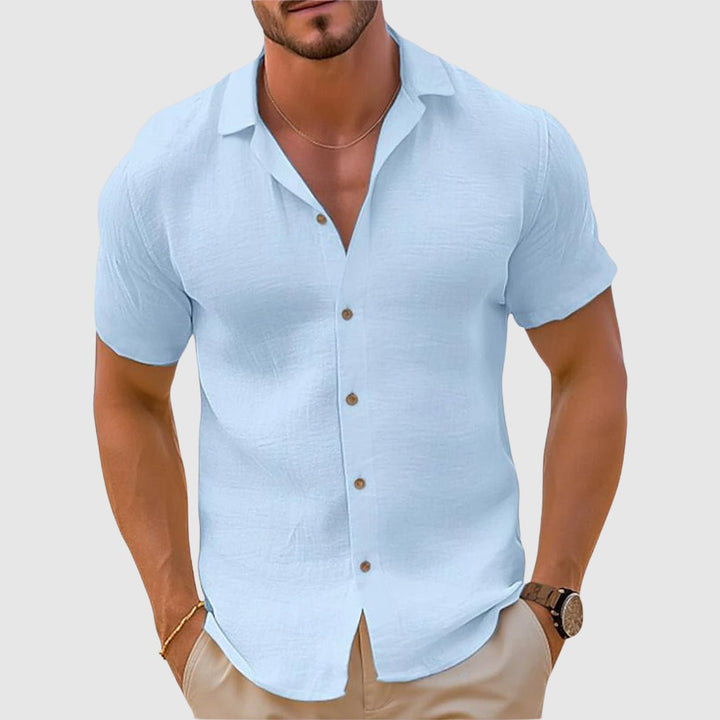 Blue men's relaxed collar short sleeve shirt. Casual and comfortable for summer, travel, and everyday wear.