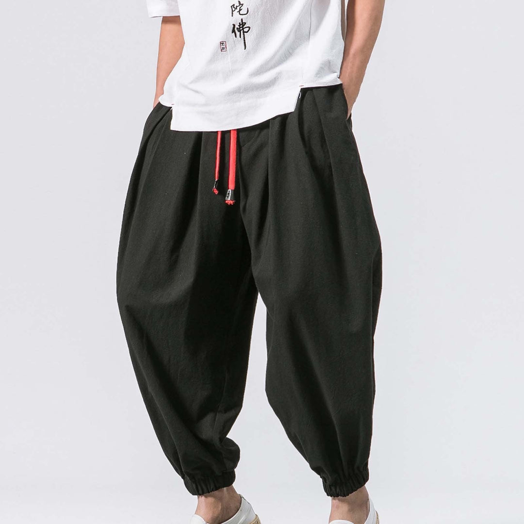 Men's relaxed fit baggy harem jogger pants in black, perfect for casual wear & everyday comfort.