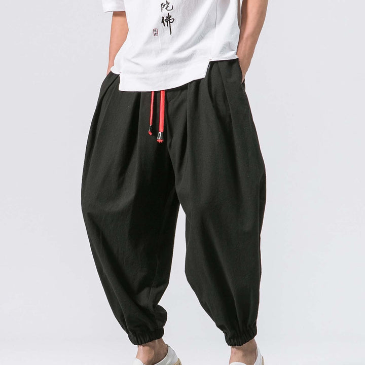 Men's relaxed fit baggy harem jogger pants in black, perfect for casual wear & everyday comfort.