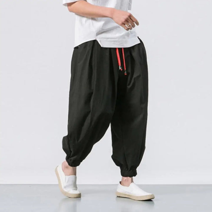 Comfortable men's baggy harem jogger pants with adjustable waist, ideal for lounge, yoga & athletic wear.