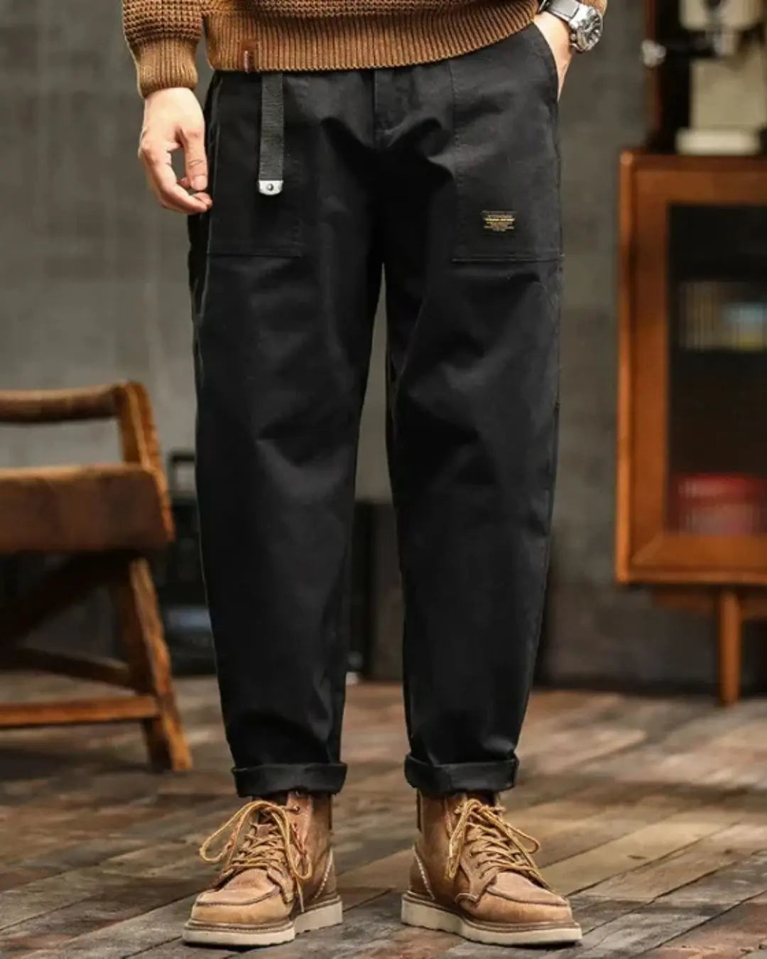 Durable men's relaxed fit cargo pants with ample storage, blending utility & comfort.
