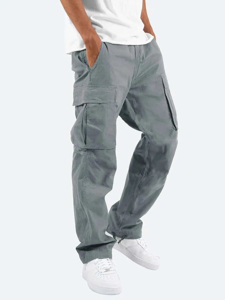 Front view of men's versatile drawstring cargo pants, showcasing pockets & relaxed fit for active wear.