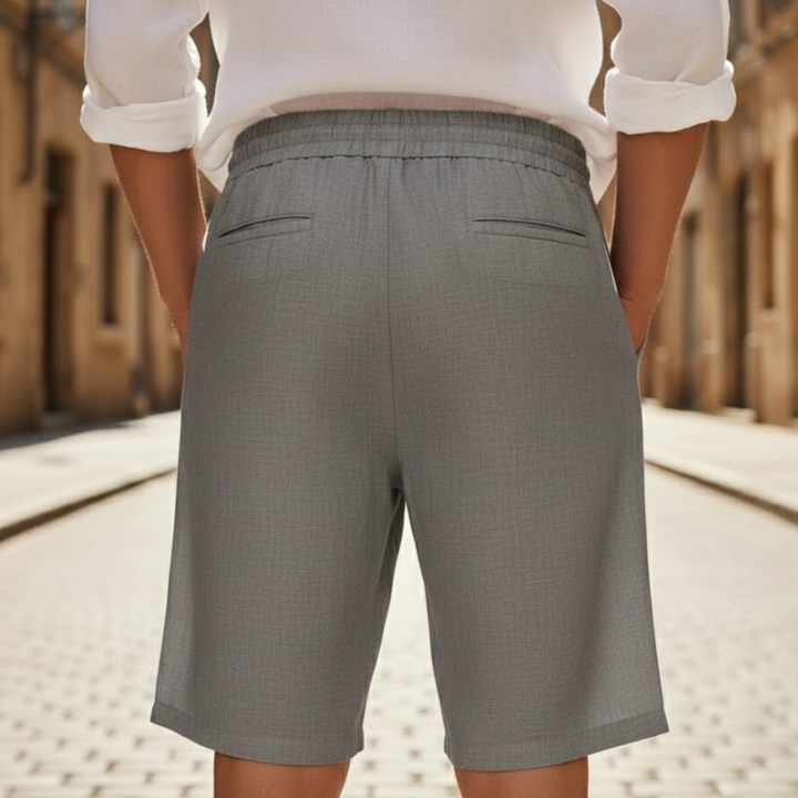 Comfortable men's knee-length drawstring shorts with an elastic waist, perfect for beach, resort, or vacation.