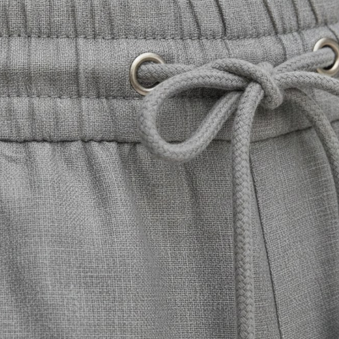 Men's relaxed fit summer shorts, knee-length with drawstring, essential for warm weather and vacation outfits.
