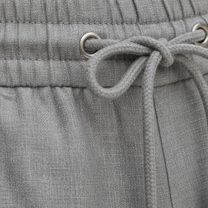Men's relaxed fit summer shorts, knee-length with drawstring, essential for warm weather and vacation outfits.