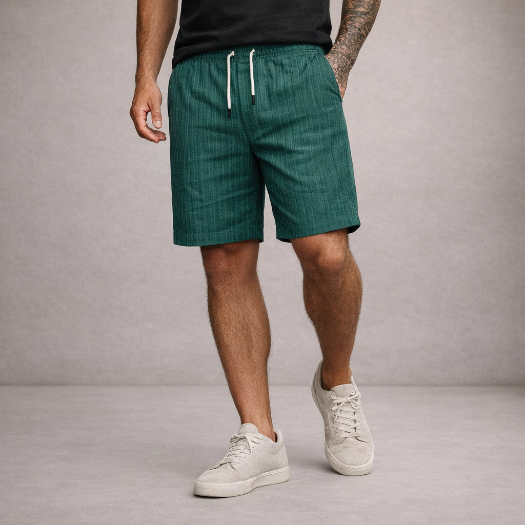 Man in relaxed fit drawstring knee-length summer shorts, showcasing casual style and comfort.