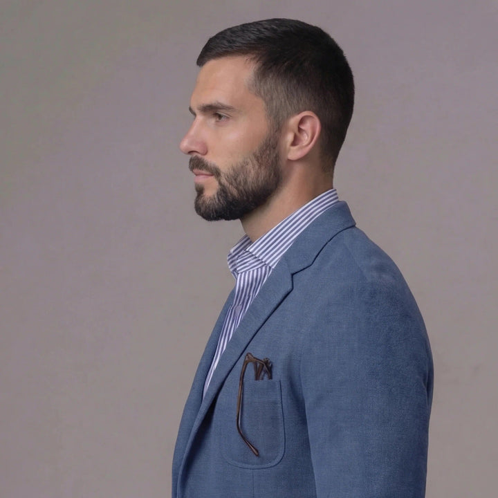 Man wearing a relaxed fit lightweight blazer jacket, showcasing stylish summer menswear.